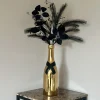 Champagne fles vaas goud met zwart kunst bladeren